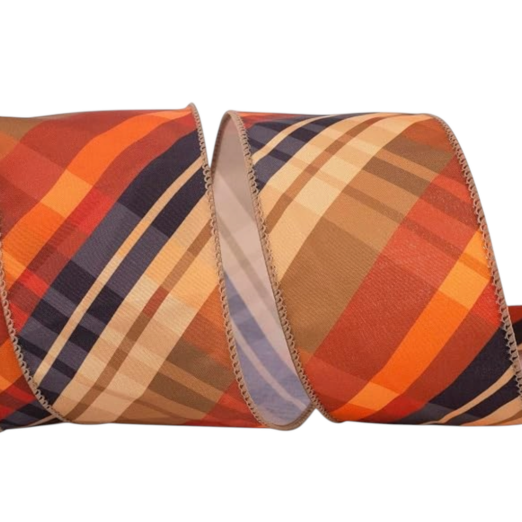 The Matthew John Collective wired edge ribbon featuring a diagonal plaid pattern in autumn orange, navy, and tan tones.