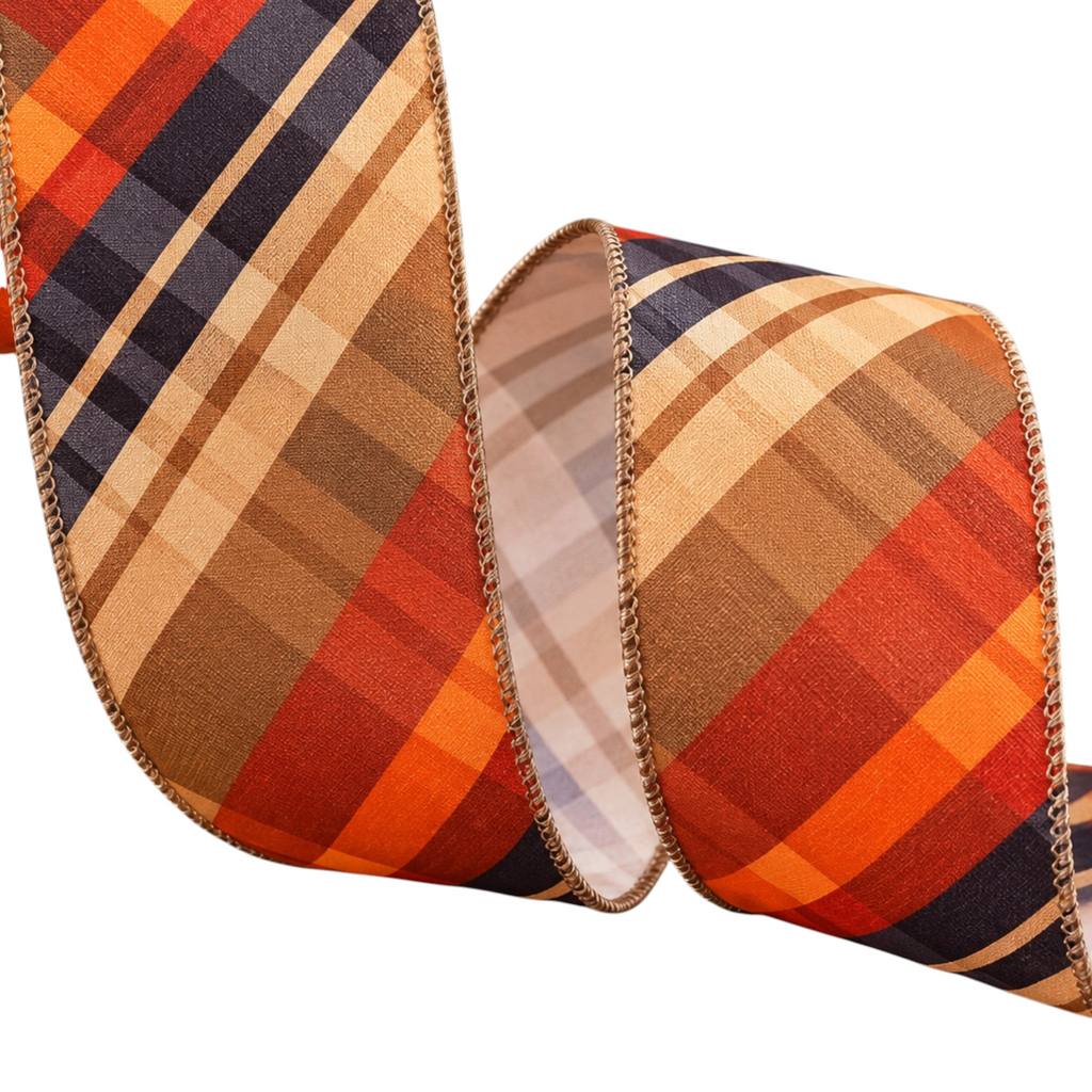 The Matthew John Collective diagonal plaid wired ribbon in autumn tones of orange, rust, navy, and tan for fall decor.