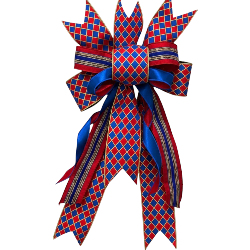 The Matthew John Collective handmade designer wreath bow featuring a red, blue, and gold diamond pattern with long tails.