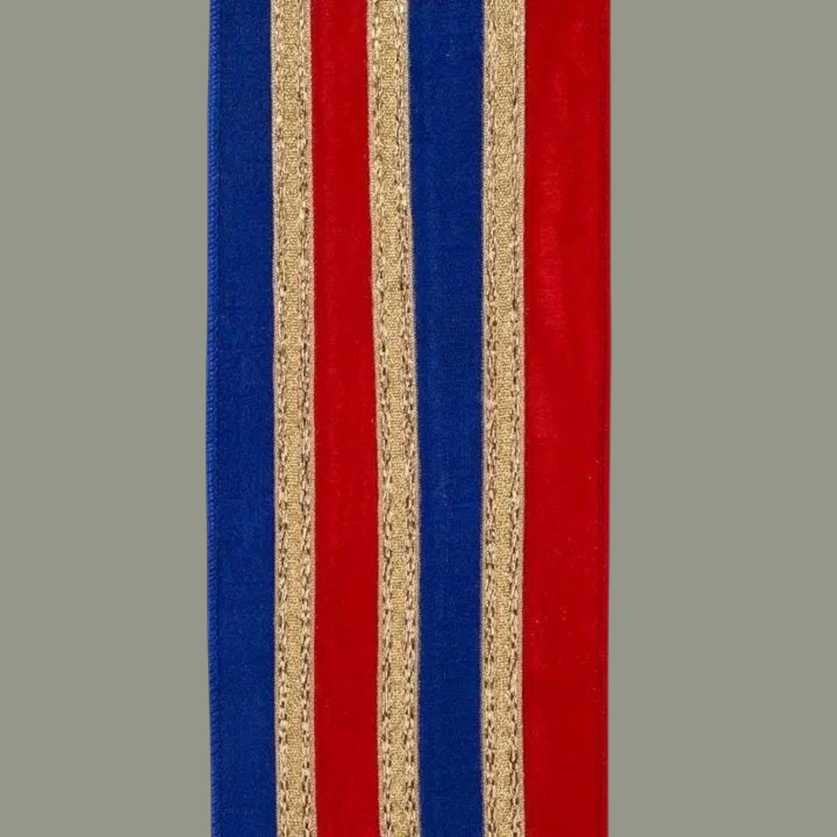 The Matthew John Collective 4-inch red and royal blue dupioni wired ribbon with metallic gold stripe trim overlay.