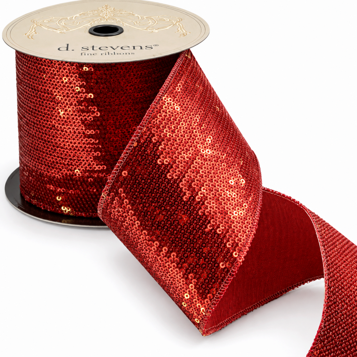 The Matthew John Collective 4-inch red and gold sequin Christmas ribbon with a smooth red taffeta backing on a spool.