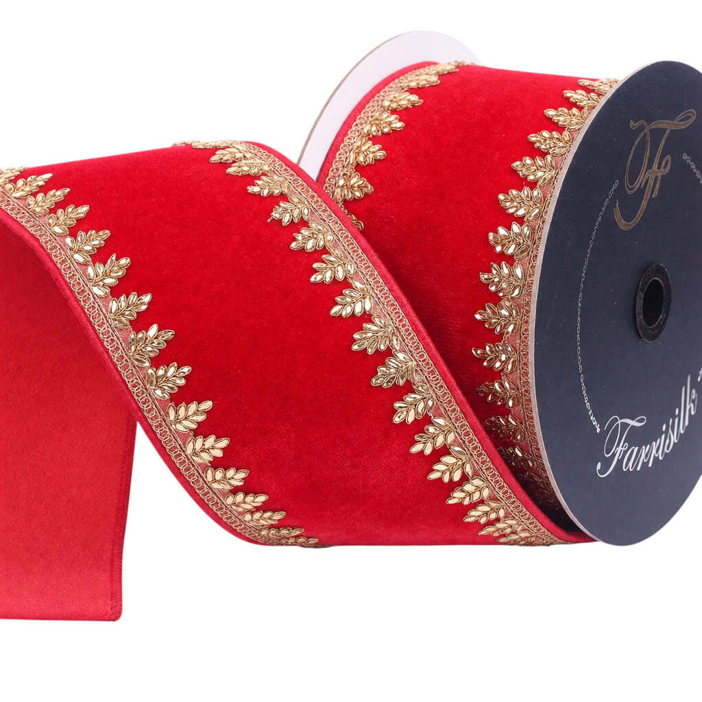 The Matthew John Collective Farrisilk Pinyon red velvet holiday ribbon with intricate gold leaf trim and wired edges.