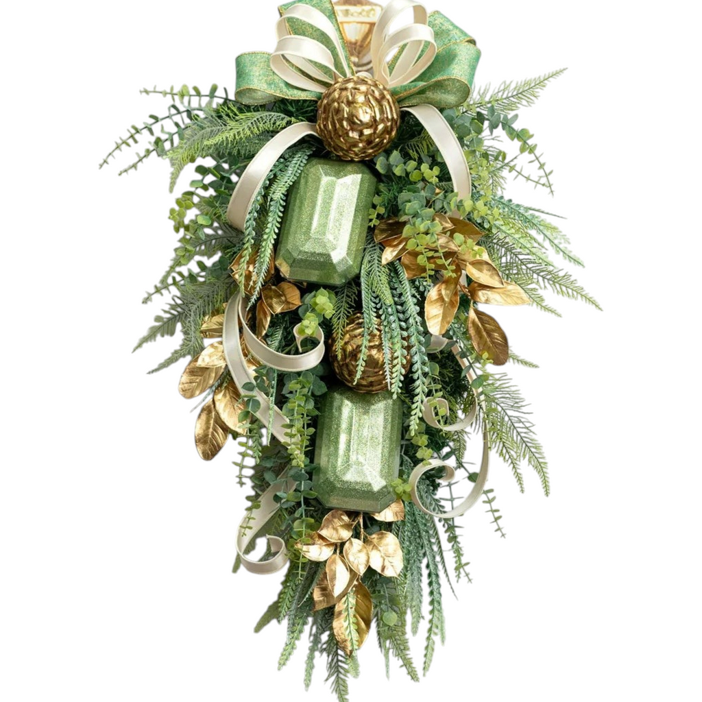 The Matthew John Collective sage green glitter gem ornament featured in a lush holiday swag with gold accents.