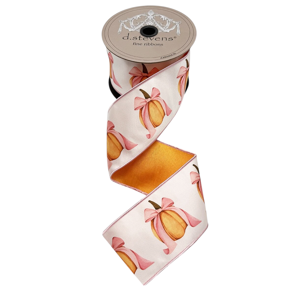 The Matthew John Collective D Stevens satin ribbon featuring a pumpkin print with pink bows on a 3 inch wide spool