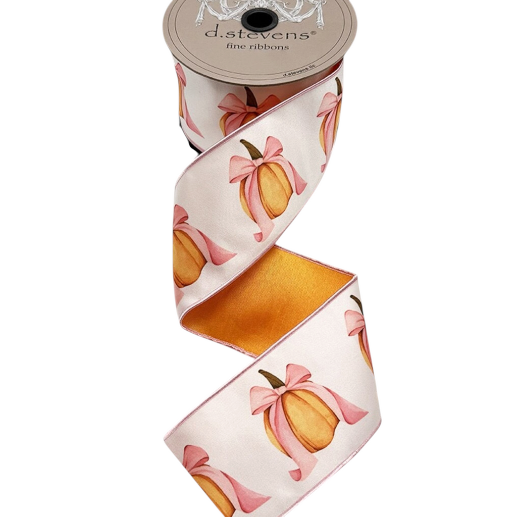 The Matthew John Collective D Stevens satin ribbon featuring orange pumpkins with pink bows on a 10-yard spool