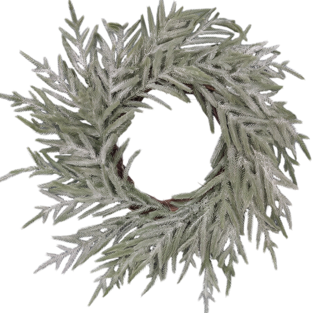 The Matthew John Collective 22-inch snowy Norfolk pine wreath with realistic needles on a dark blue front door.