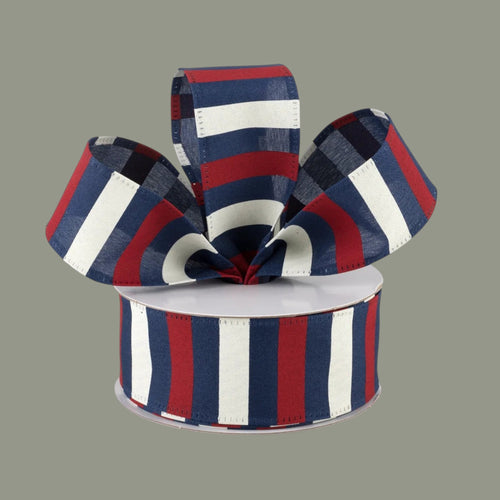 The Matthew John Collective 1.5 inch wired satin ribbon featuring red, ivory, and navy blue horizontal stripes.