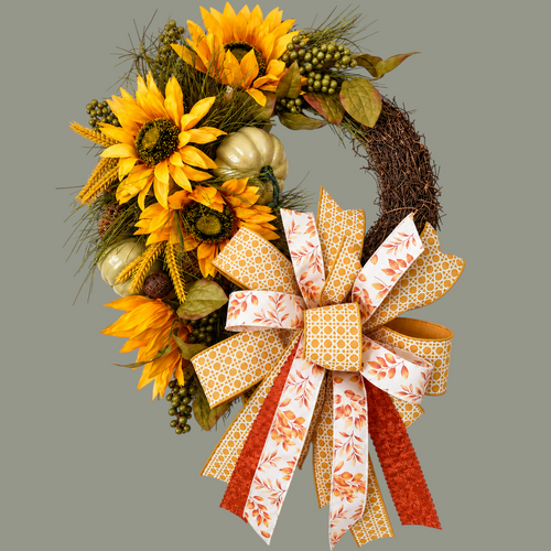 The Matthew John Collective 18-inch autumn grapevine wreath with sunflowers, pumpkins, berries, and a designer bow.