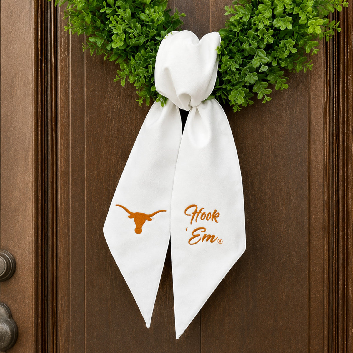The Matthew John Collective white fabric wreath sash with embroidered Texas Longhorn logo and Hook Em text