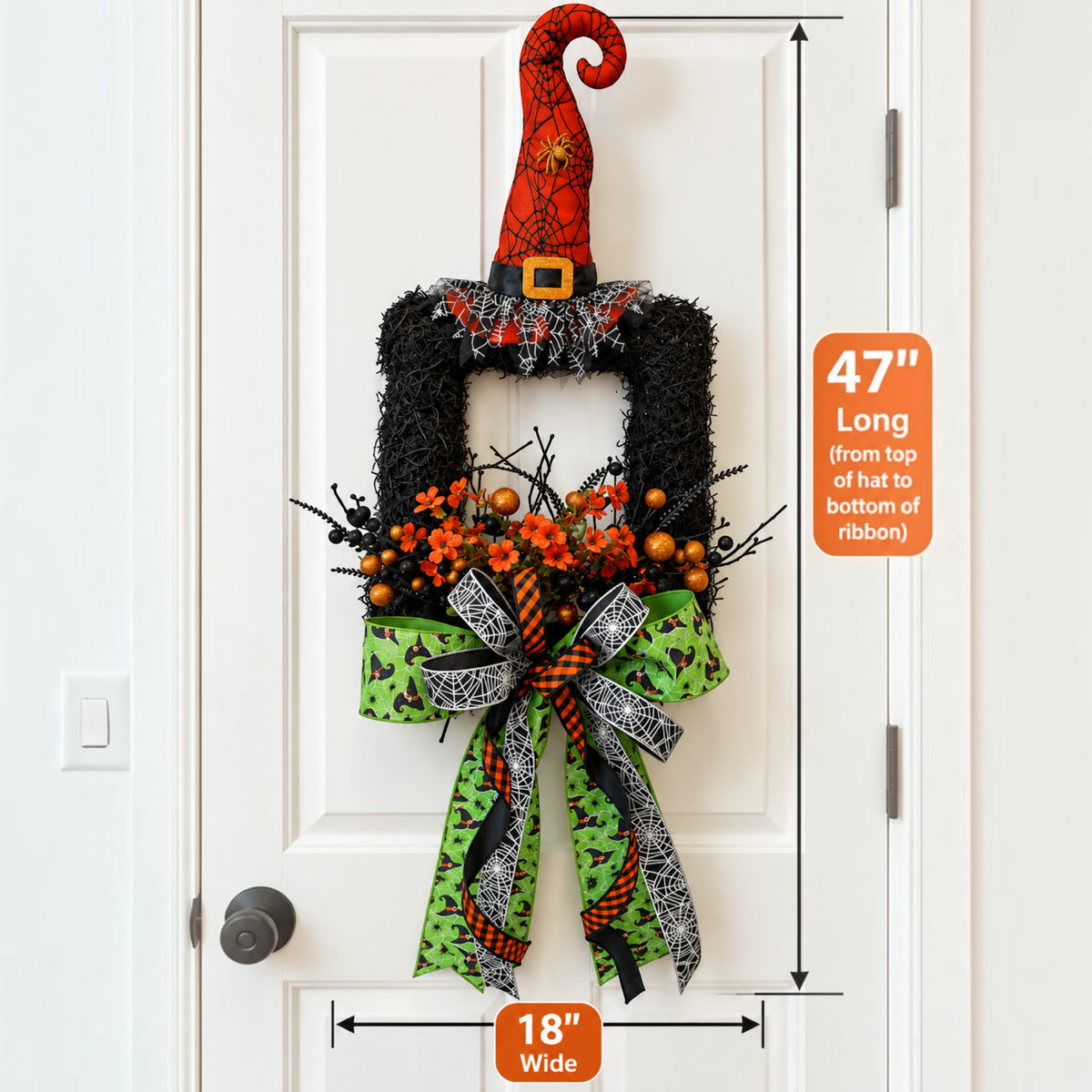 The Matthew John Collective Wicked Witch Halloween wreath with a red hat, orange florals, and green patterned ribbons.